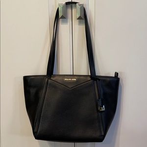 Michael Kors dark baby bag